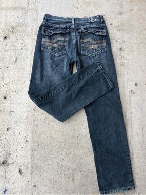 Dark Wash low rise bootcut jeans with a cute back pocket design